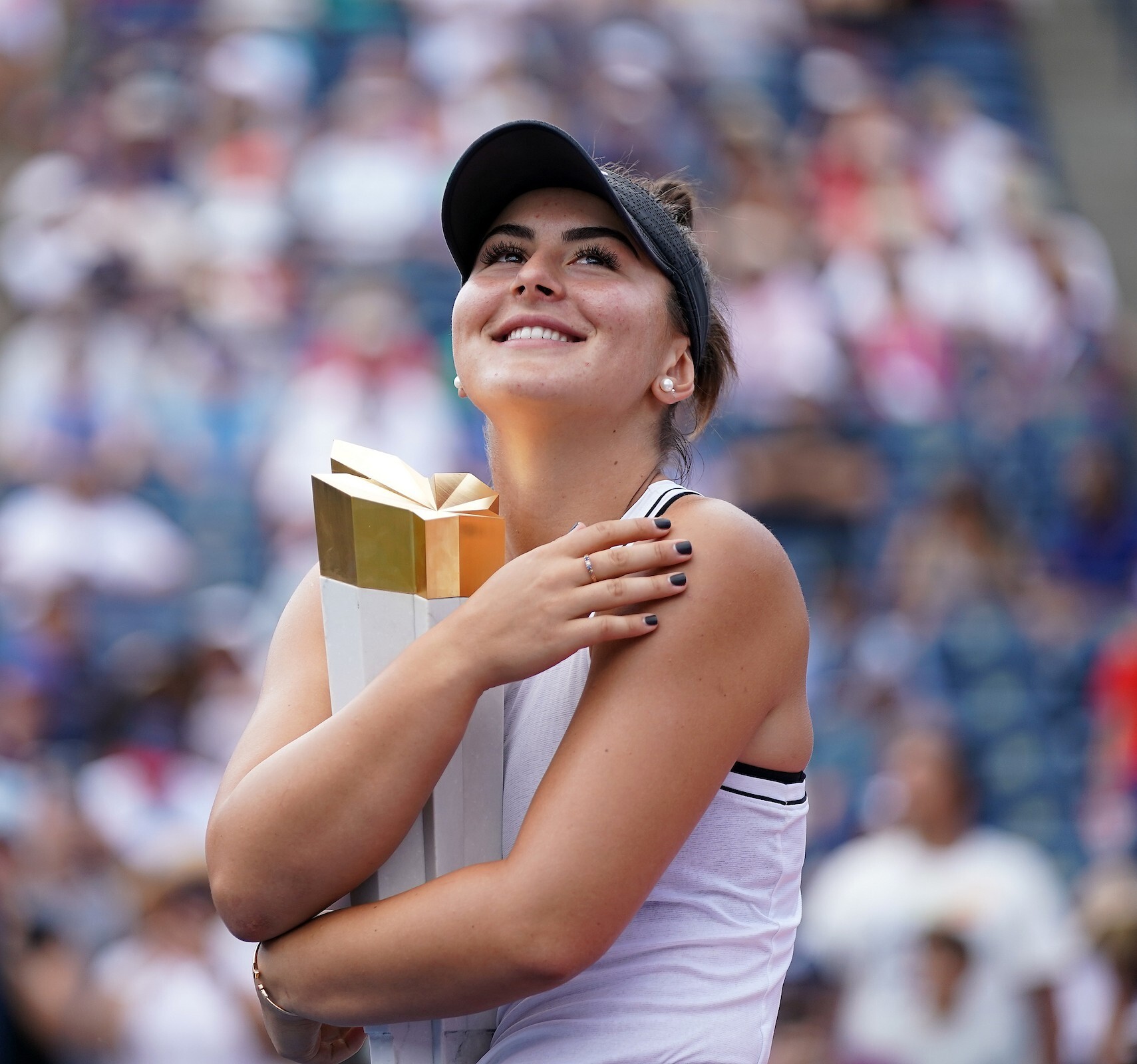 Sunday, August 11, 2019 - Rogers Cup Champion Bianca Andreescu poses with her trophy after her final match at Rogers Cup presented by National Bank at the Aviva Centre in Toronto, Ontario. (Peter Power/Tennis Canada)